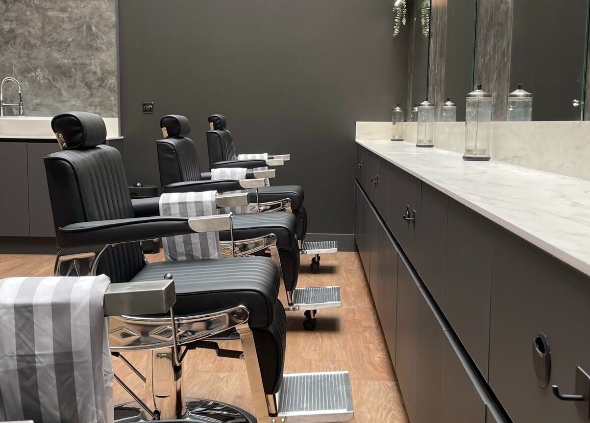 Stylish barber chairs at Gould Barbers West Bromwich, West Bromwich, England, GB reflecting a modern setting.