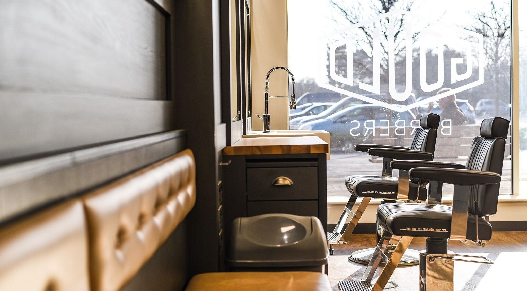Interior of Gould Barbers Long Eaton, stylish chairs, and window view, Long Eaton, England, GB.