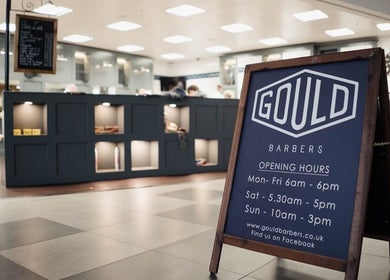 Gould Barbers Long Eaton indoor signage displaying opening hours in Long Eaton, England, GB.