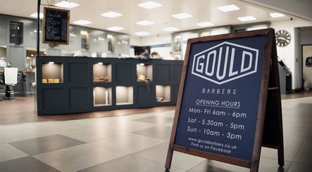 Gould Barbers Long Eaton indoor signage displaying opening hours in Long Eaton, England, GB.