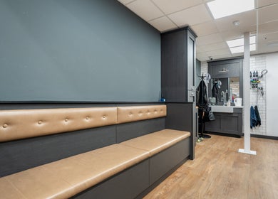 Modern seating and workstation at Gould Barbers Cheshunt, Cheshunt, England, GB, showcasing stylish decor.
