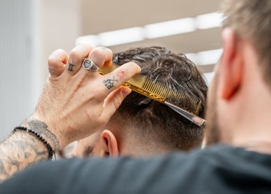 Professional barber styling hair at Gould Barbers Cheshunt, Cheshunt, England, GB.