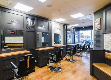 Interior of Gould Barbers Ipswich in Ipswich, England, GB featuring modern barber chairs and sleek design.