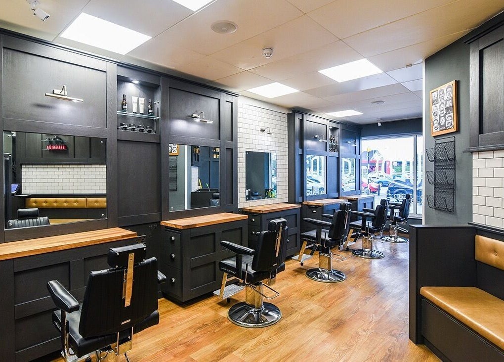 Interior of Gould Barbers Ipswich in Ipswich, England, GB featuring modern barber chairs and sleek design.