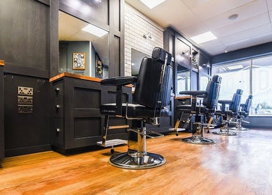 Modern barber chairs at Gould Barbers Ipswich, Ipswich, England, GB showcasing sleek interior design.