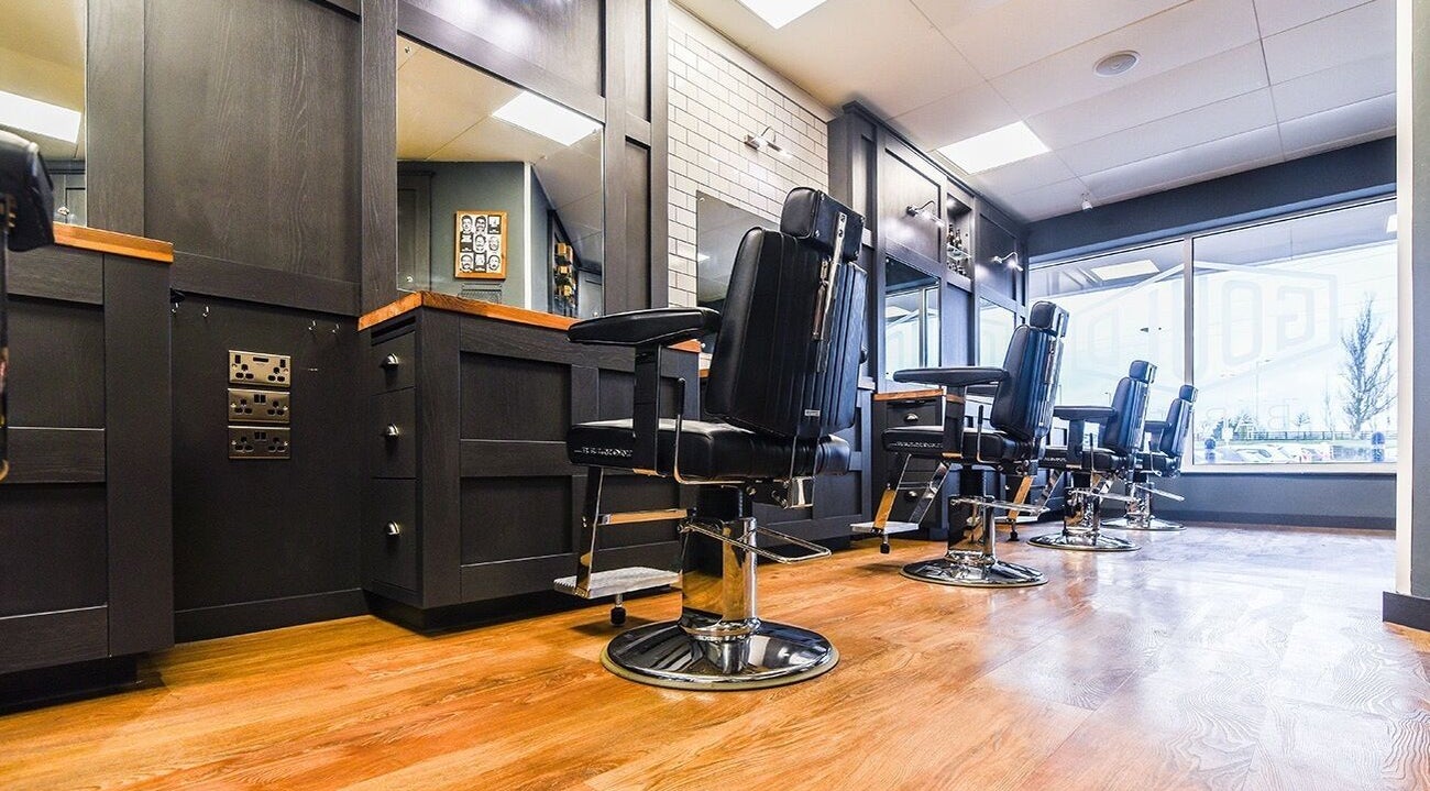 Modern barber chairs at Gould Barbers Ipswich, Ipswich, England, GB showcasing sleek interior design.