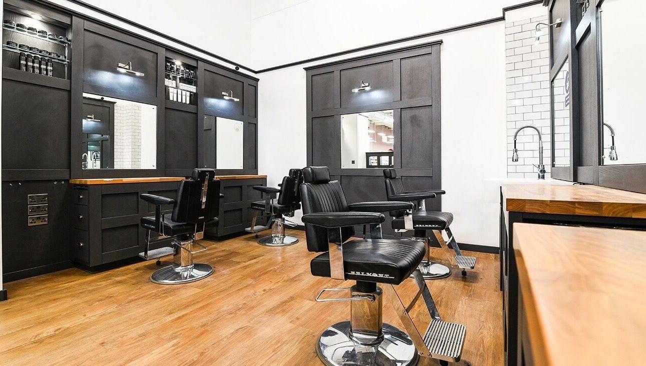 Modern barber chairs and sleek decor at Gould Barbers Walsall, located in Walsall, England, GB.