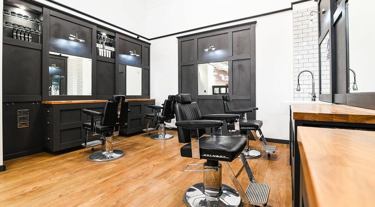 Modern barber chairs and sleek decor at Gould Barbers Walsall, located in Walsall, England, GB.