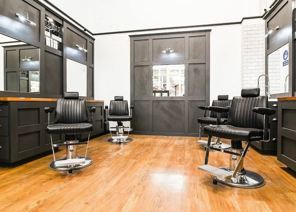 Modern barber chairs at Gould Barbers Walsall, an elegant grooming venue in Walsall, England, GB.