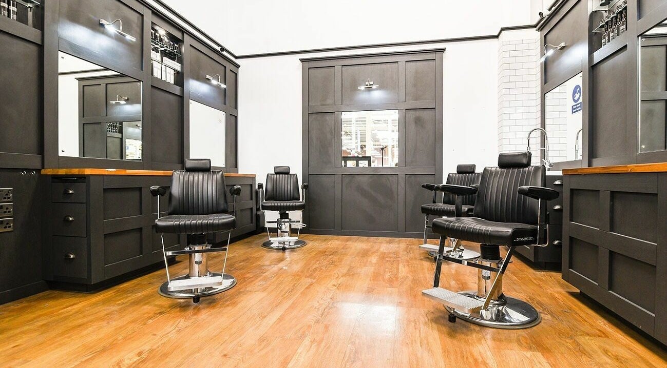 Modern barber chairs at Gould Barbers Walsall, an elegant grooming venue in Walsall, England, GB.
