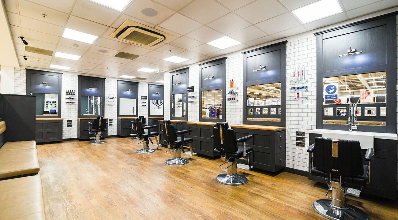 Interior view of stylish Gould Barbers Coventry, featuring sleek black chairs at Coventry, England, GB location.