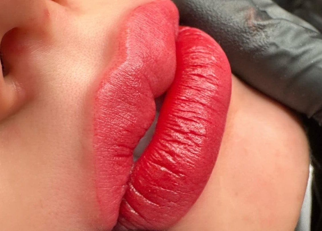 Close-up of red lips tattoo at Galaxy Lashes, Melbourne, Victoria, AU showcasing expert beauty services.