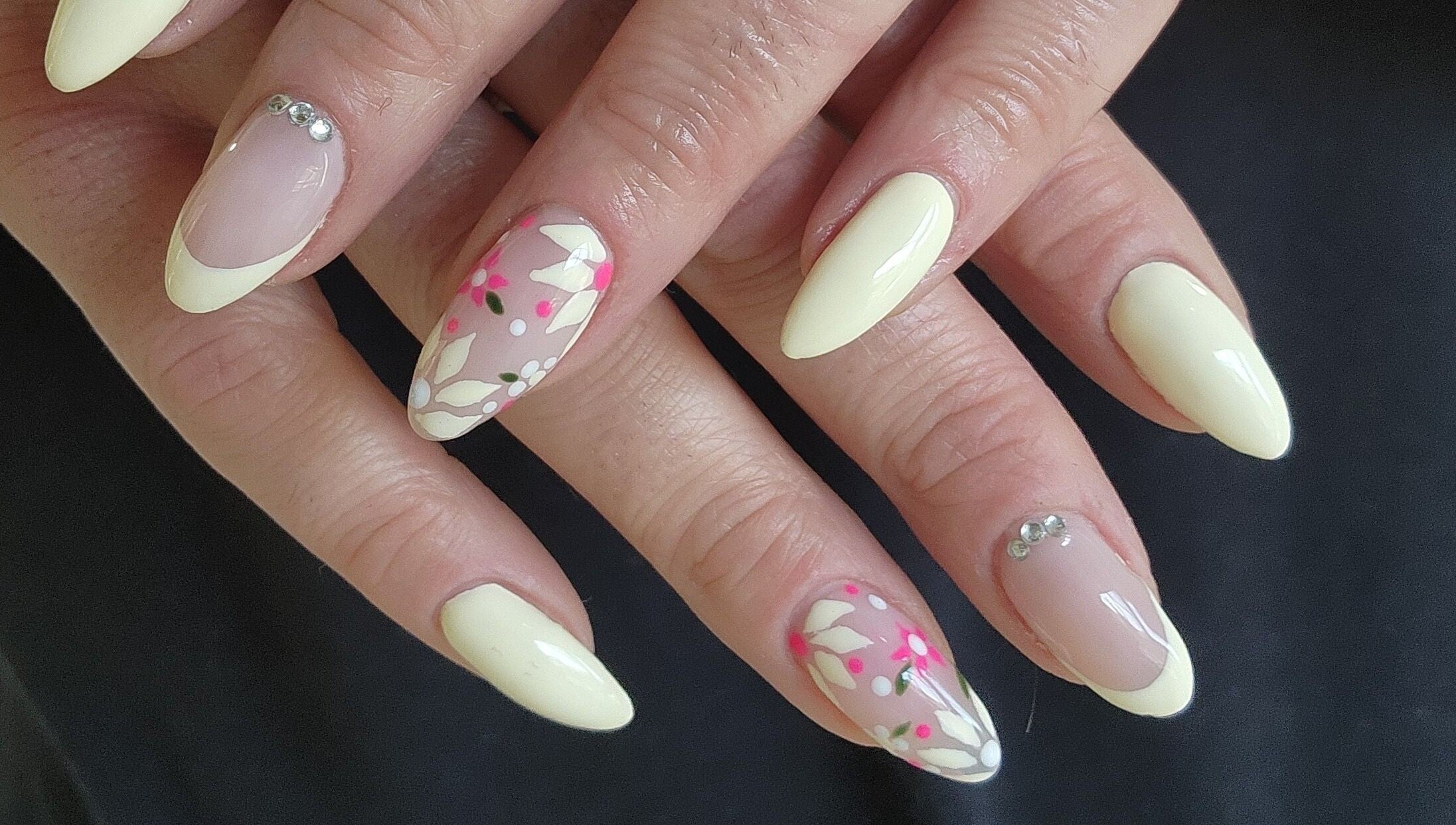 Stylish floral nail art at Esthetics by Mandi, Belle River, Ontario, CA, showcasing exquisite design.
