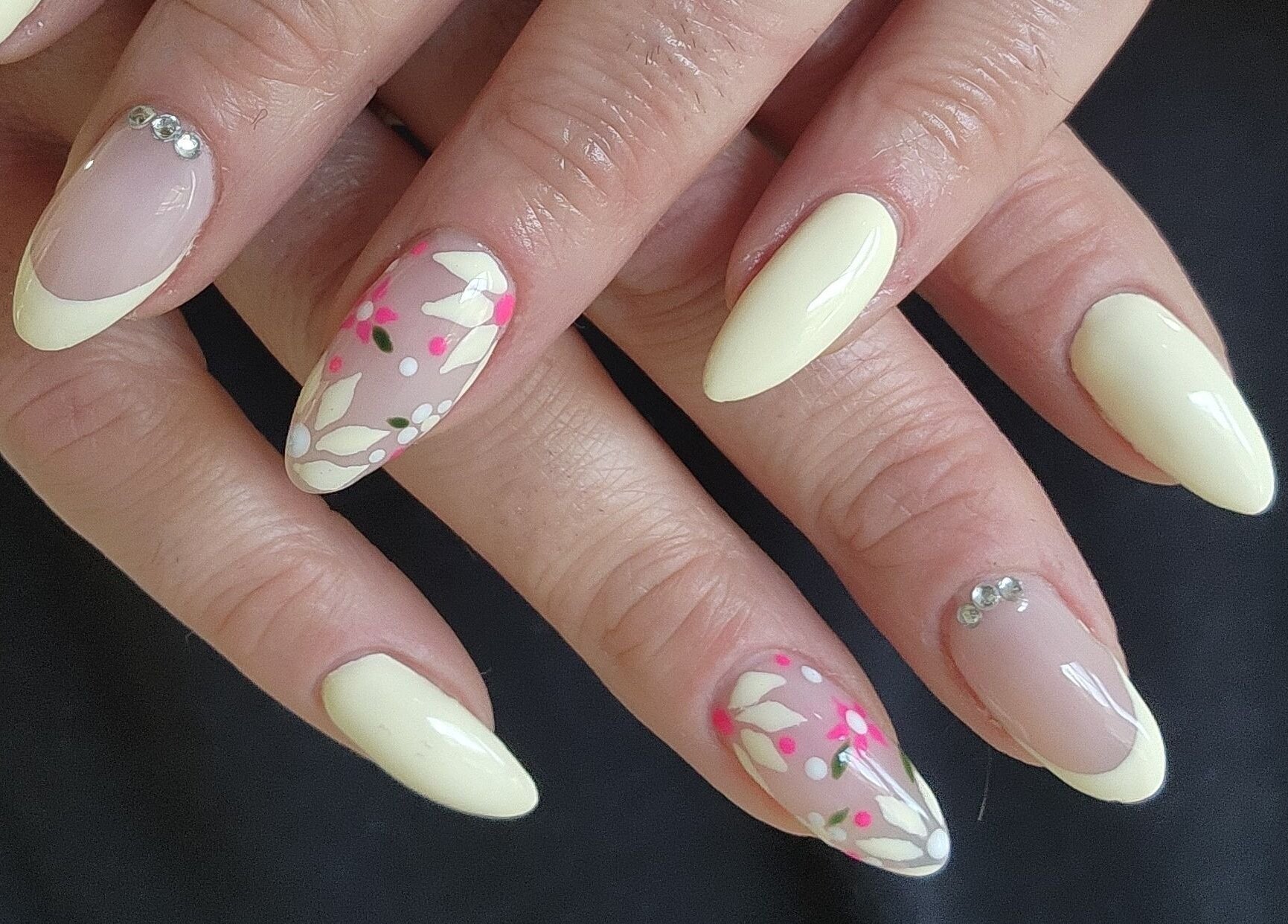 Stylish floral nail art at Esthetics by Mandi, Belle River, Ontario, CA, showcasing exquisite design.