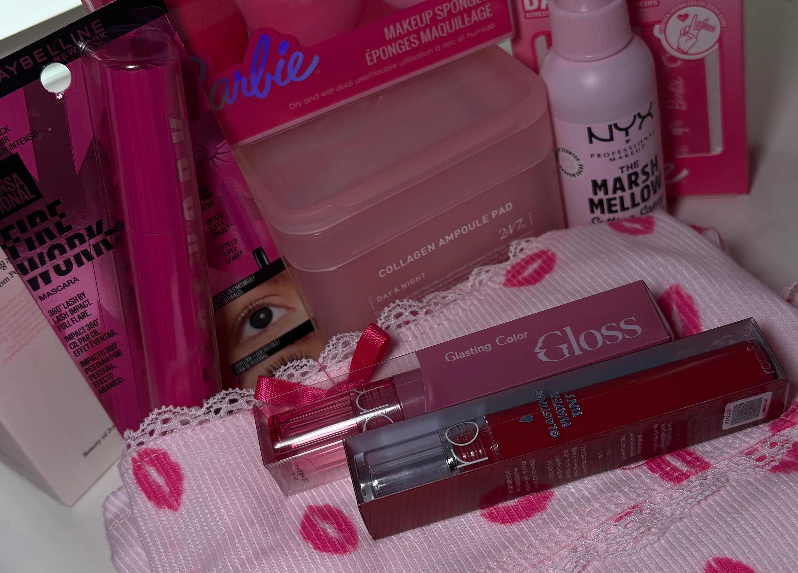 A vibrant beauty product collection at LAU, Toronto, Ontario, CA, featuring makeup essentials in pink packaging.