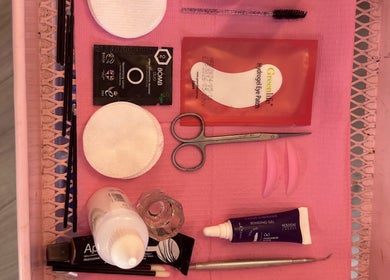 EffortlessBeauty_SLJ - Mobile Only eyelash tools and products displayed on pink tray in Telford, England, GB.