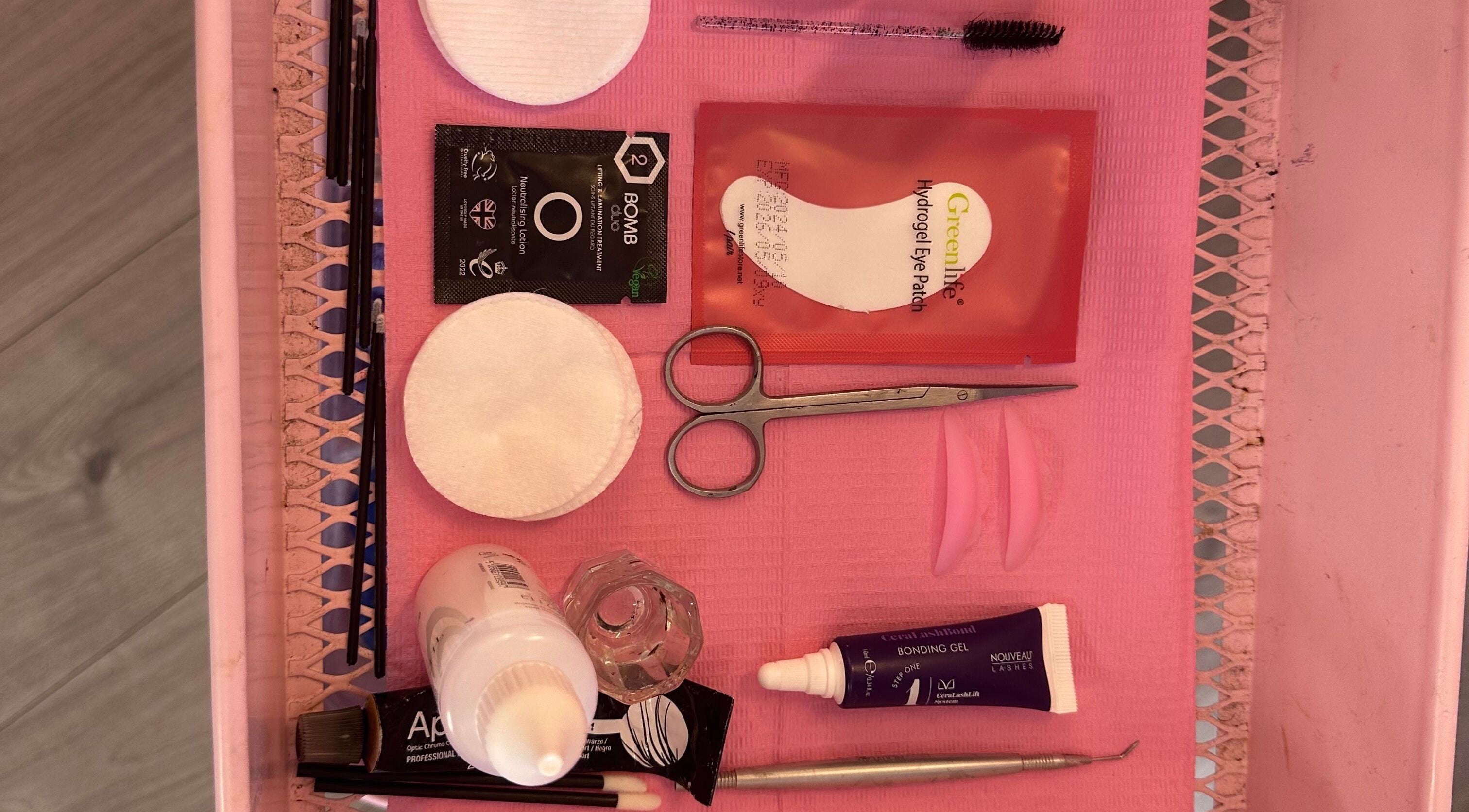 EffortlessBeauty_SLJ - Mobile Only eyelash tools and products displayed on pink tray in Telford, England, GB.