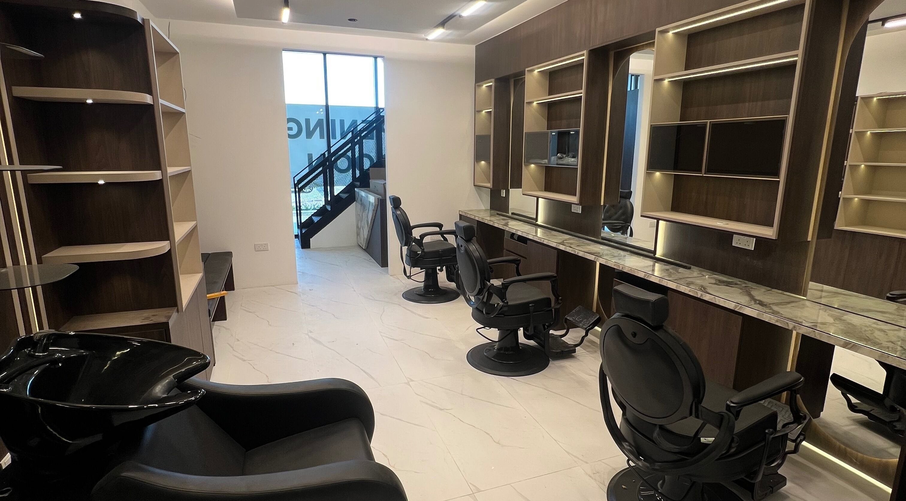 Gent Station Zayed Town salon with modern styling chairs and mirrors, located in Zayed Town, Al-muḥāfaẓat Aš-šamālīyah, BH.