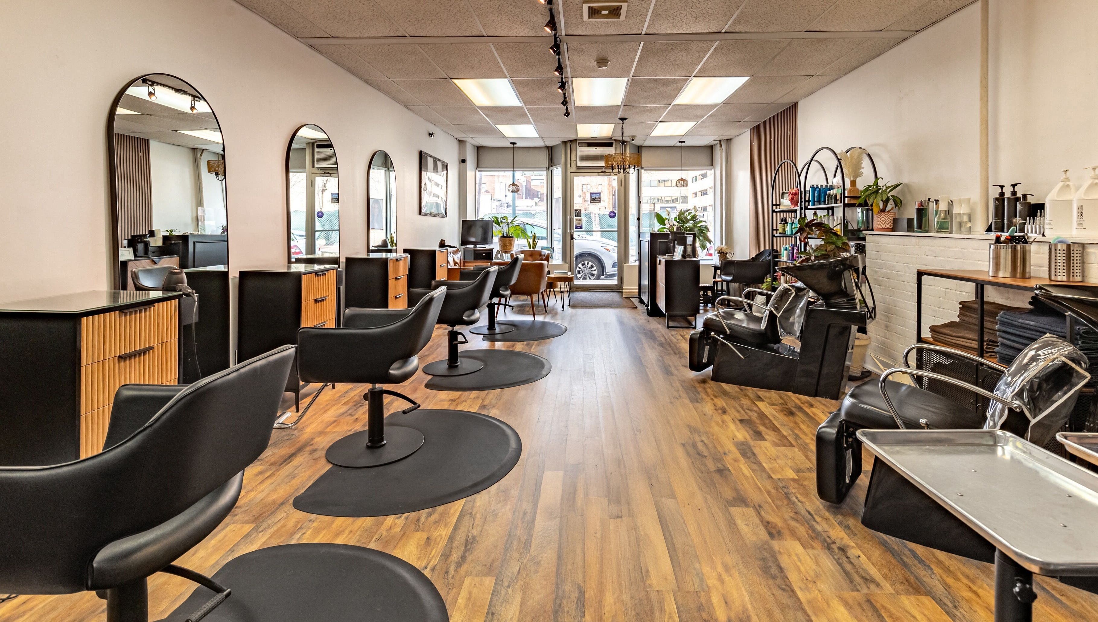 Interior of A&A Hairloft, a stylish salon in Mineola, New York, US with modern chairs and decor.