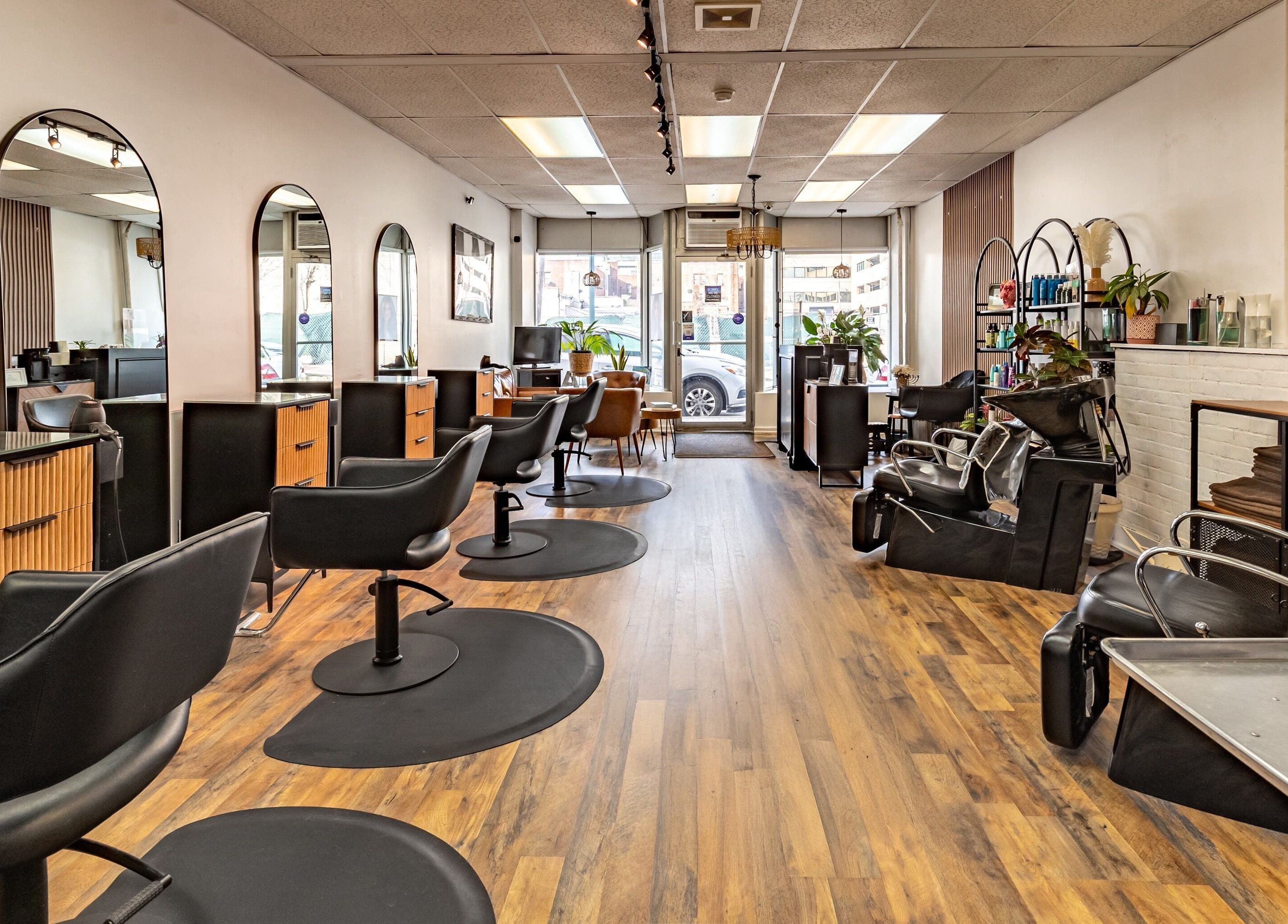 Interior of A&A Hairloft, a stylish salon in Mineola, New York, US with modern chairs and decor.