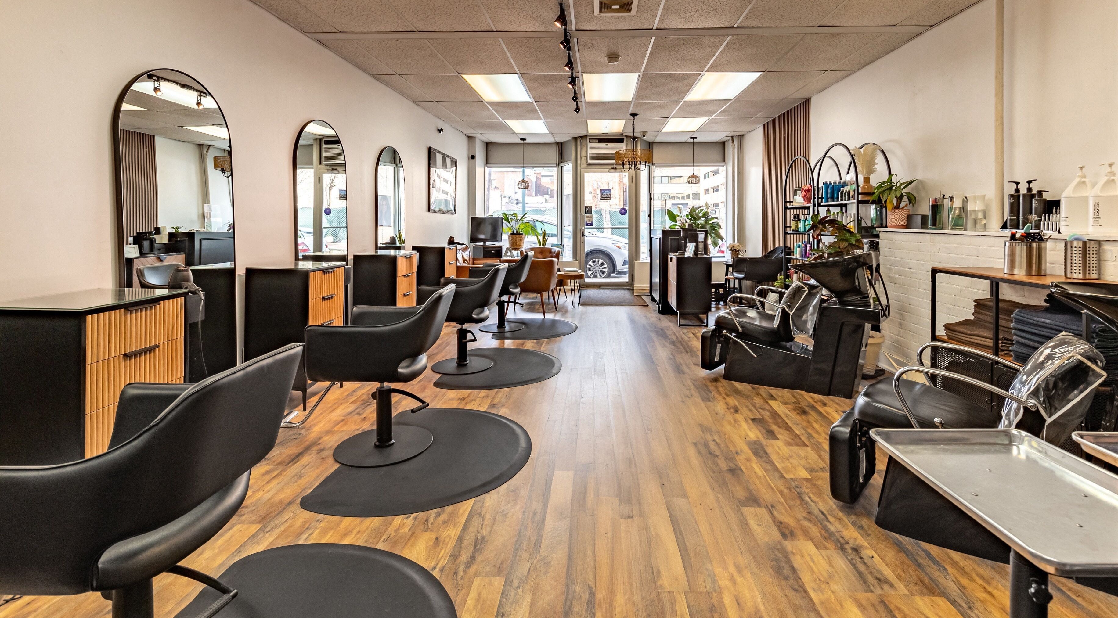 Interior of A&A Hairloft, a stylish salon in Mineola, New York, US with modern chairs and decor.