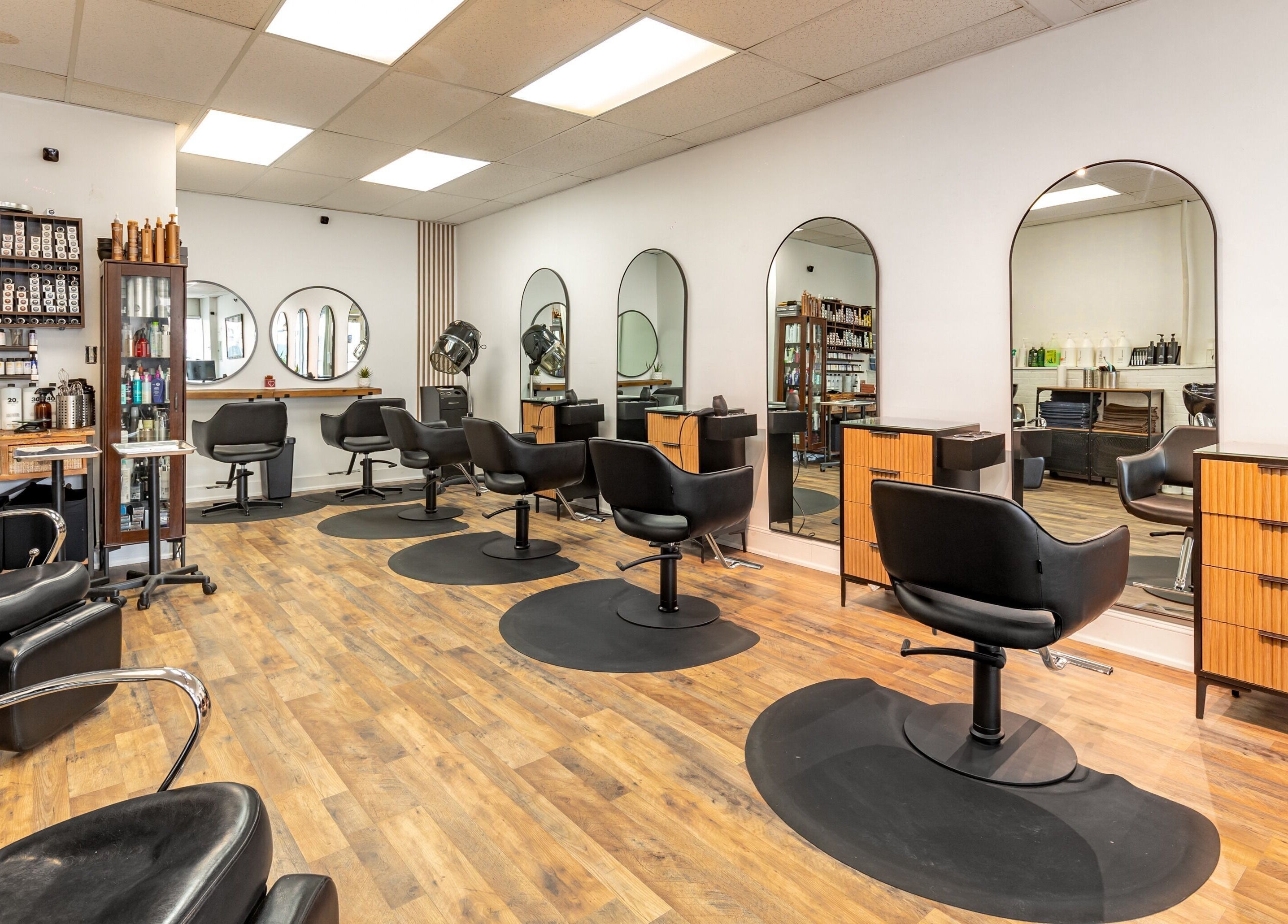 A&A Hairloft salon interior with modern chairs and mirrors in Mineola, New York, US.