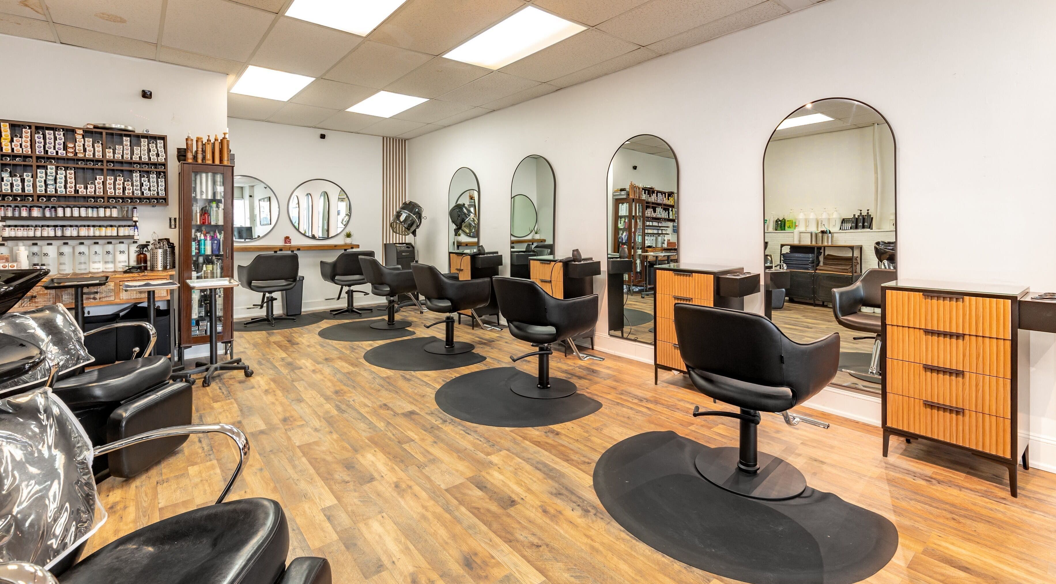 A&A Hairloft salon interior with modern chairs and mirrors in Mineola, New York, US.