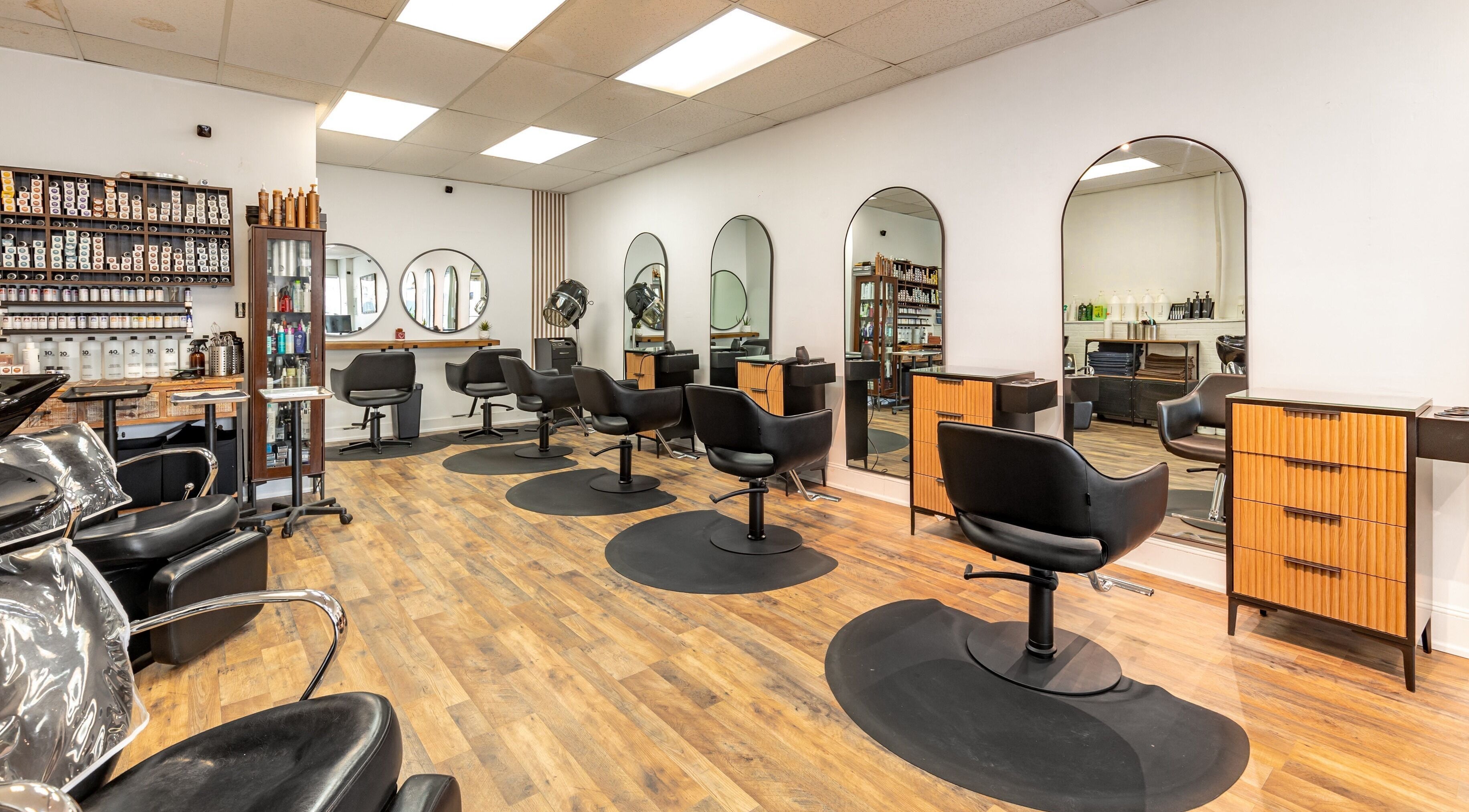 A&A Hairloft salon interior with modern chairs and mirrors in Mineola, New York, US.