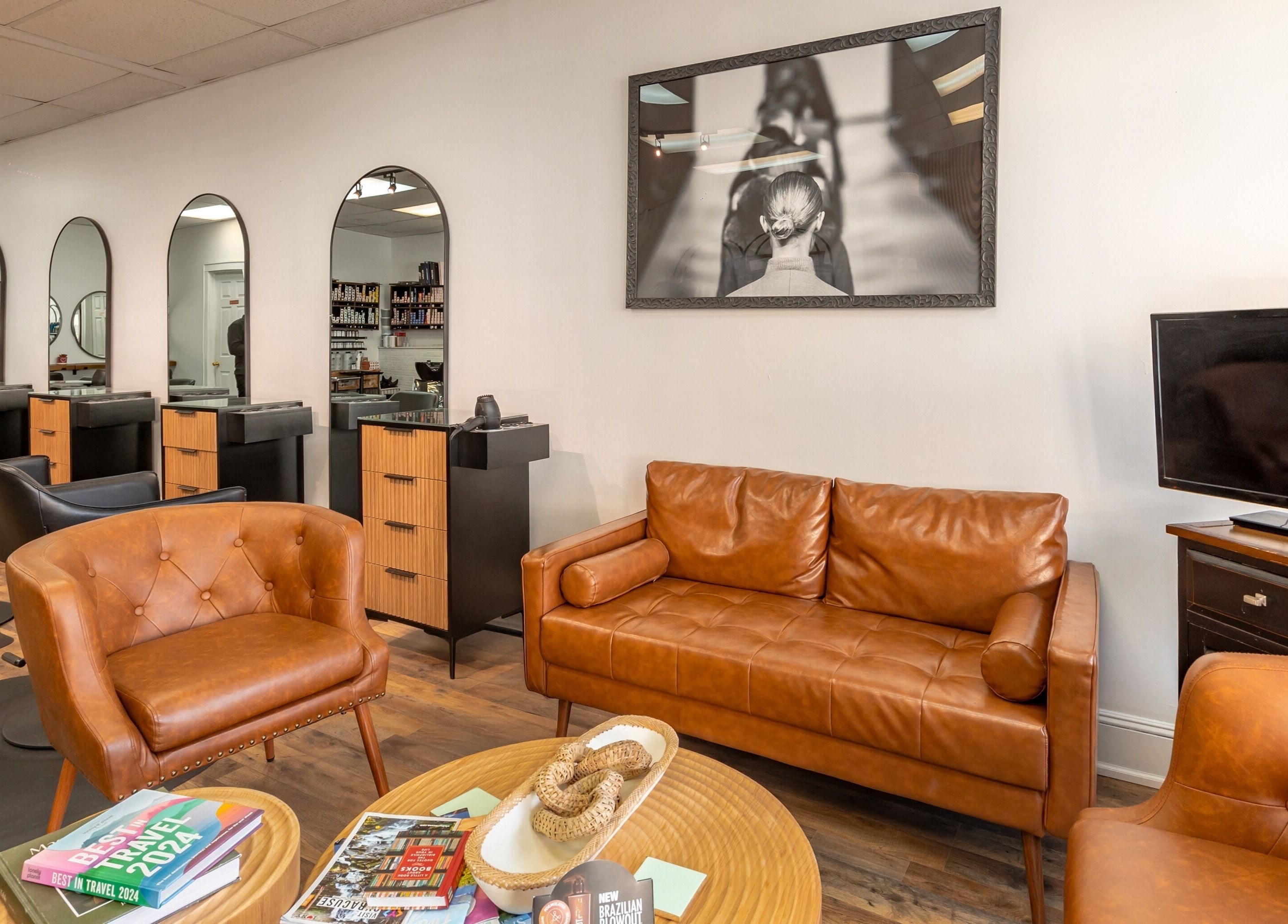 Comfortable seating area at A&A Hairloft in Mineola, New York, US showcasing modern interior design.