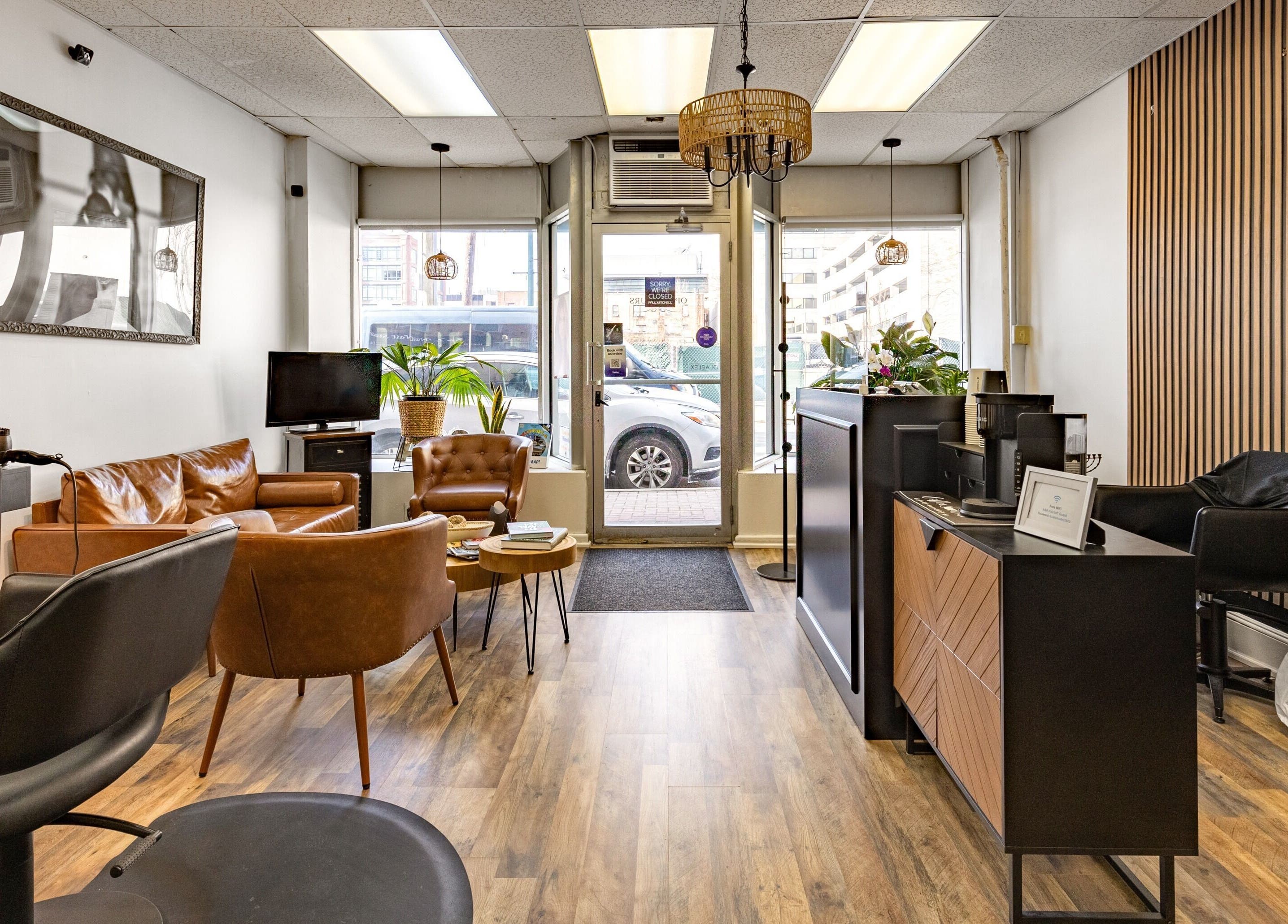 A&A Hairloft's chic, modern interior in Mineola, New York, US with stylish decor and comfortable seating.