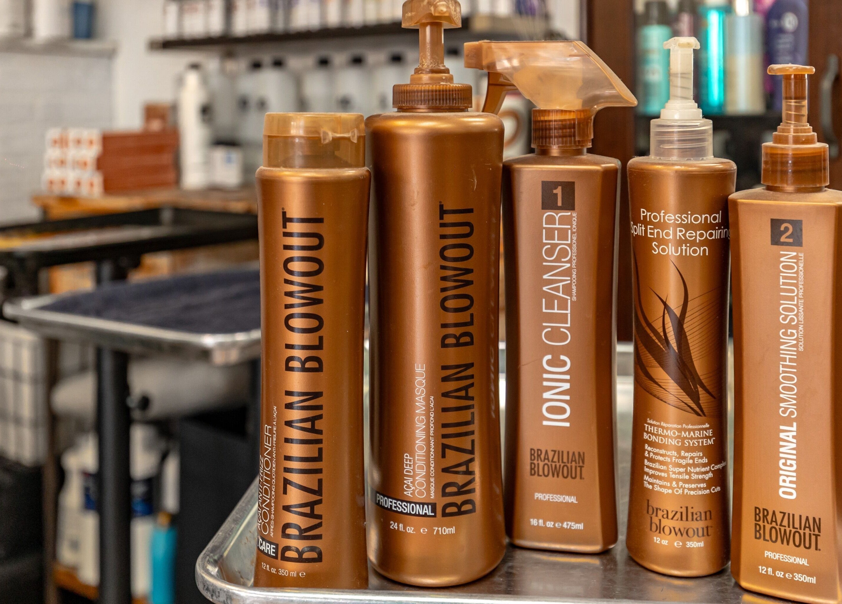 Variety of hair products at A&A Hairloft in Mineola, New York, US, showcasing Brazilian Blowout treatments.