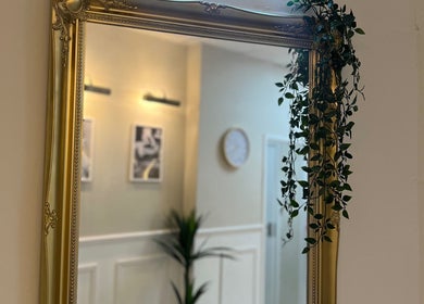 Elegant gold mirror with ivy at Hair By Grace Crofton, Hoylake, England, GB.