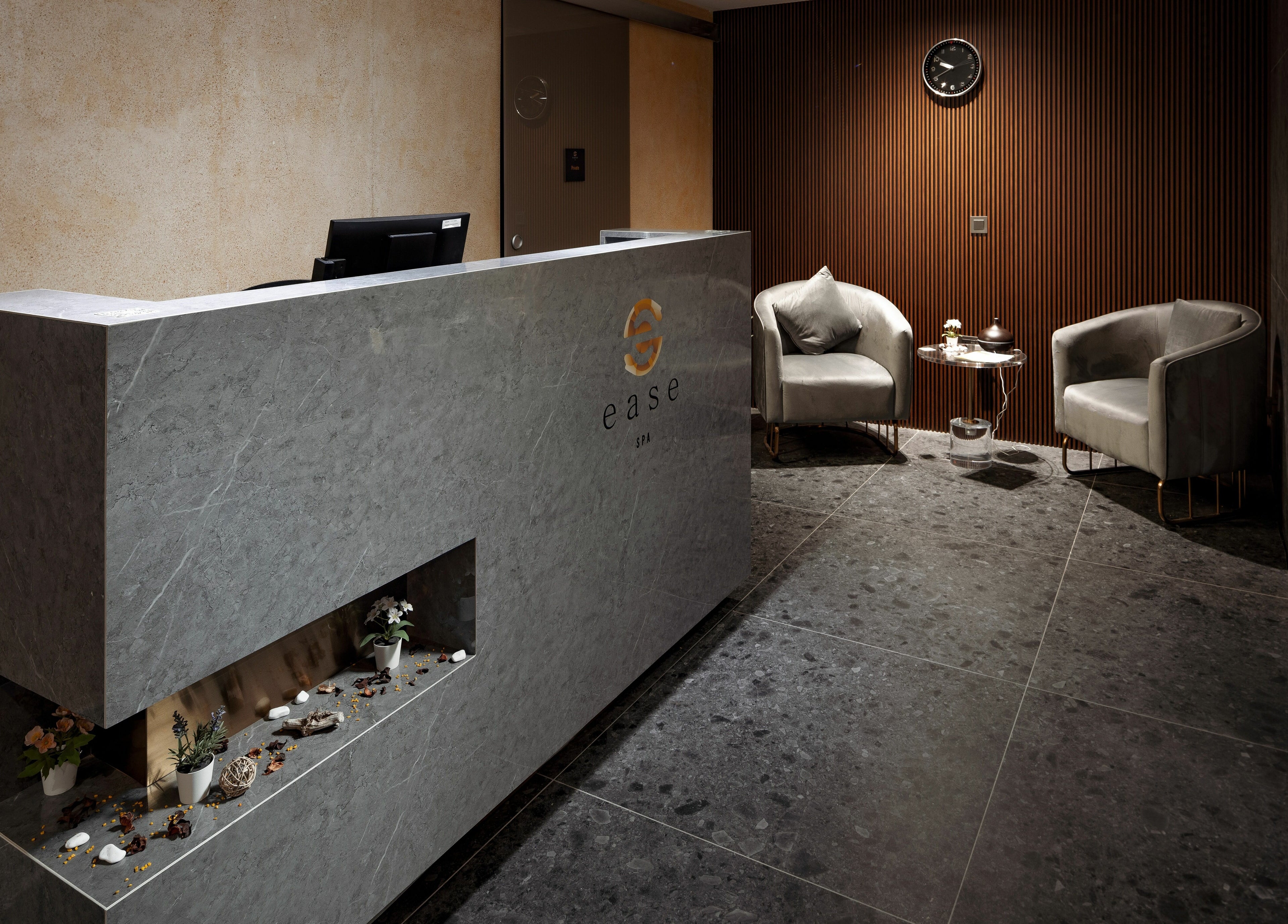 Elegant reception at Ease Spa in Gzira, MT, featuring modern decor and cozy seating.