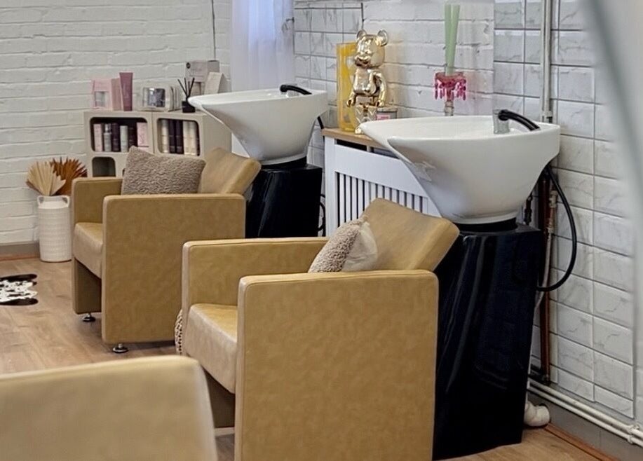 Elegant wash station with plush chairs at Saturate The Studio, Johnston, Wales, GB.