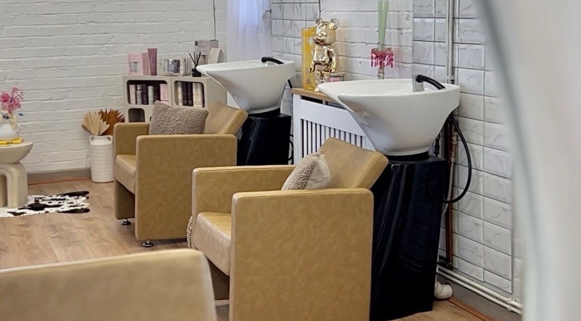 Elegant wash station with plush chairs at Saturate The Studio, Johnston, Wales, GB.