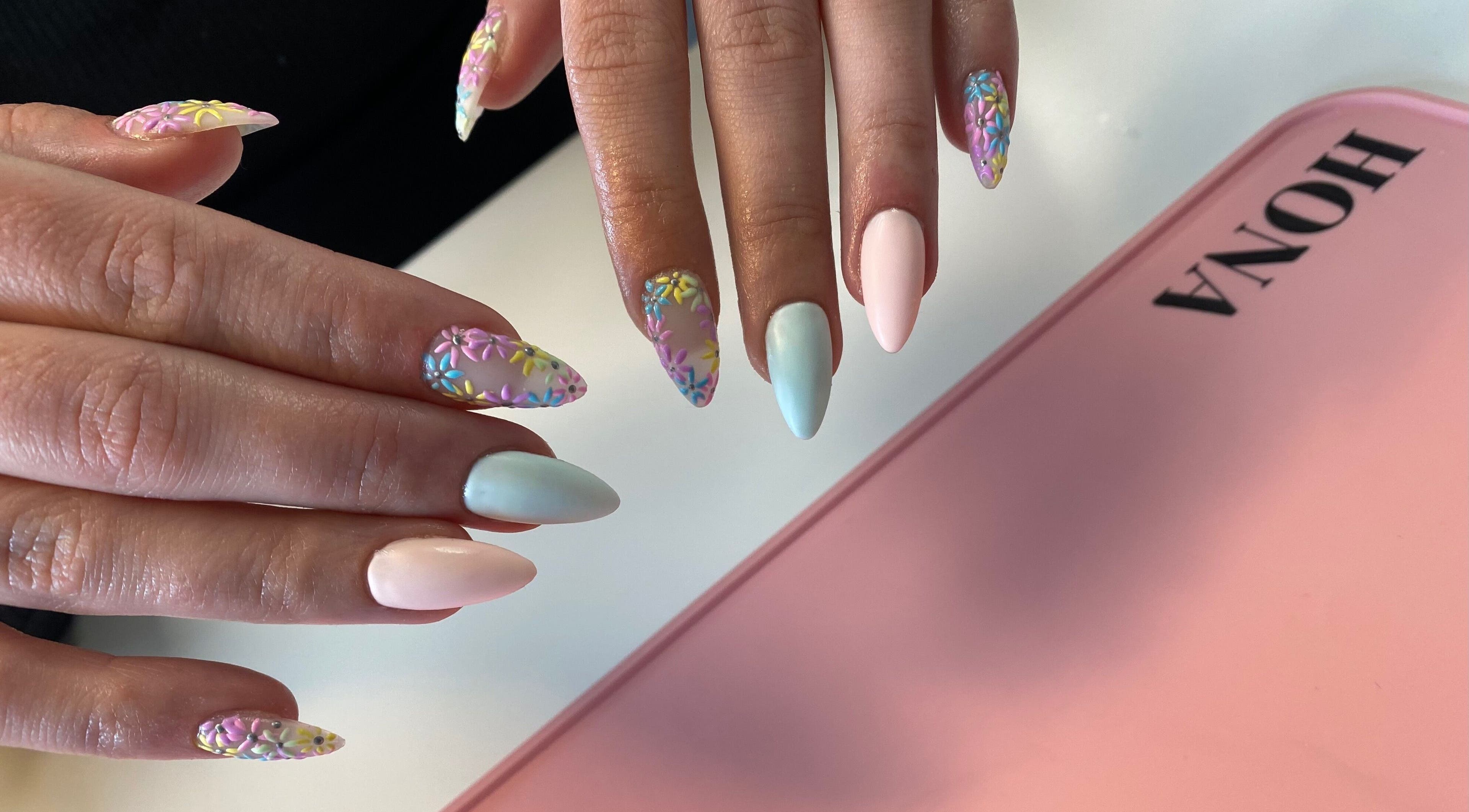 Vibrant 3D floral nail art at Nailed You By Lou, Stockport, England, GB, showcasing pastel elegance and creativity.