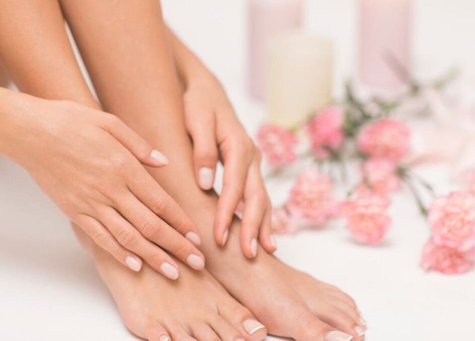 Close-up of manicured nails at Inspire Beauty at Traralgon, Traralgon, Victoria, AU with pink flowers decor.
