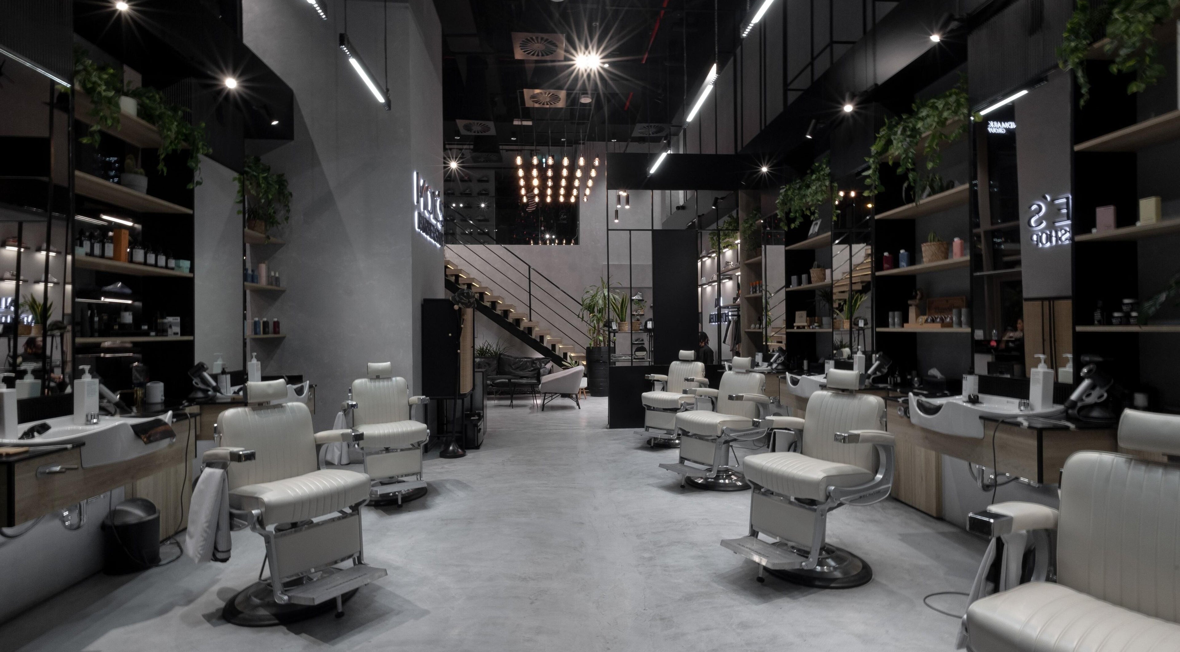 Elegant interior of Moe's Barbershop - Dubai Marina located in Dubai, Dubai, AE with modern barber chairs.