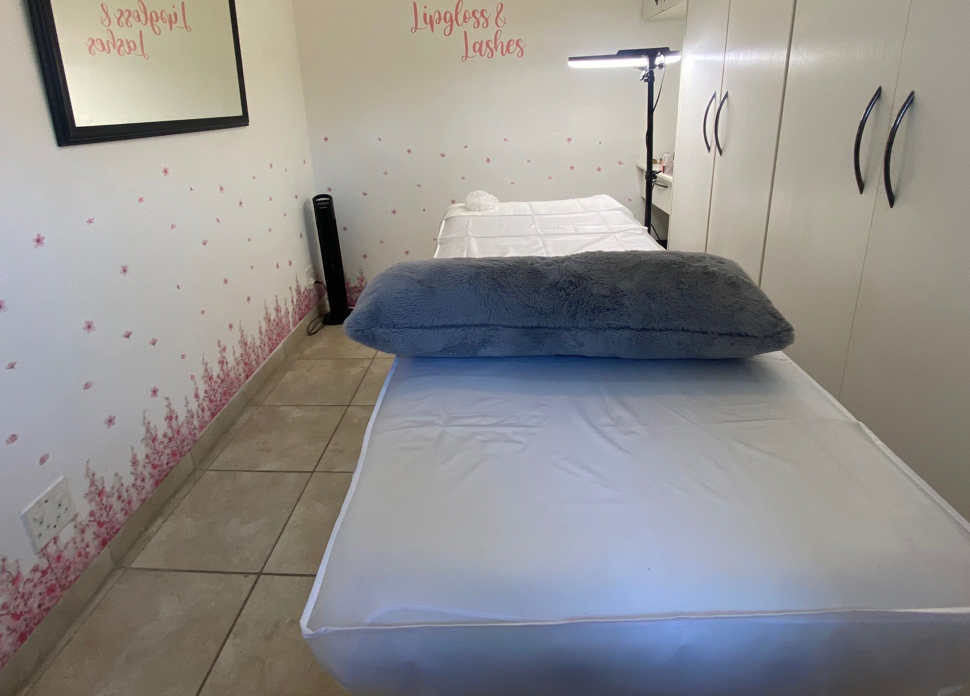 Relaxing treatment room at Lipgloss and Lashes Norwood, Johannesburg, Gauteng, ZA with plush bedding.
