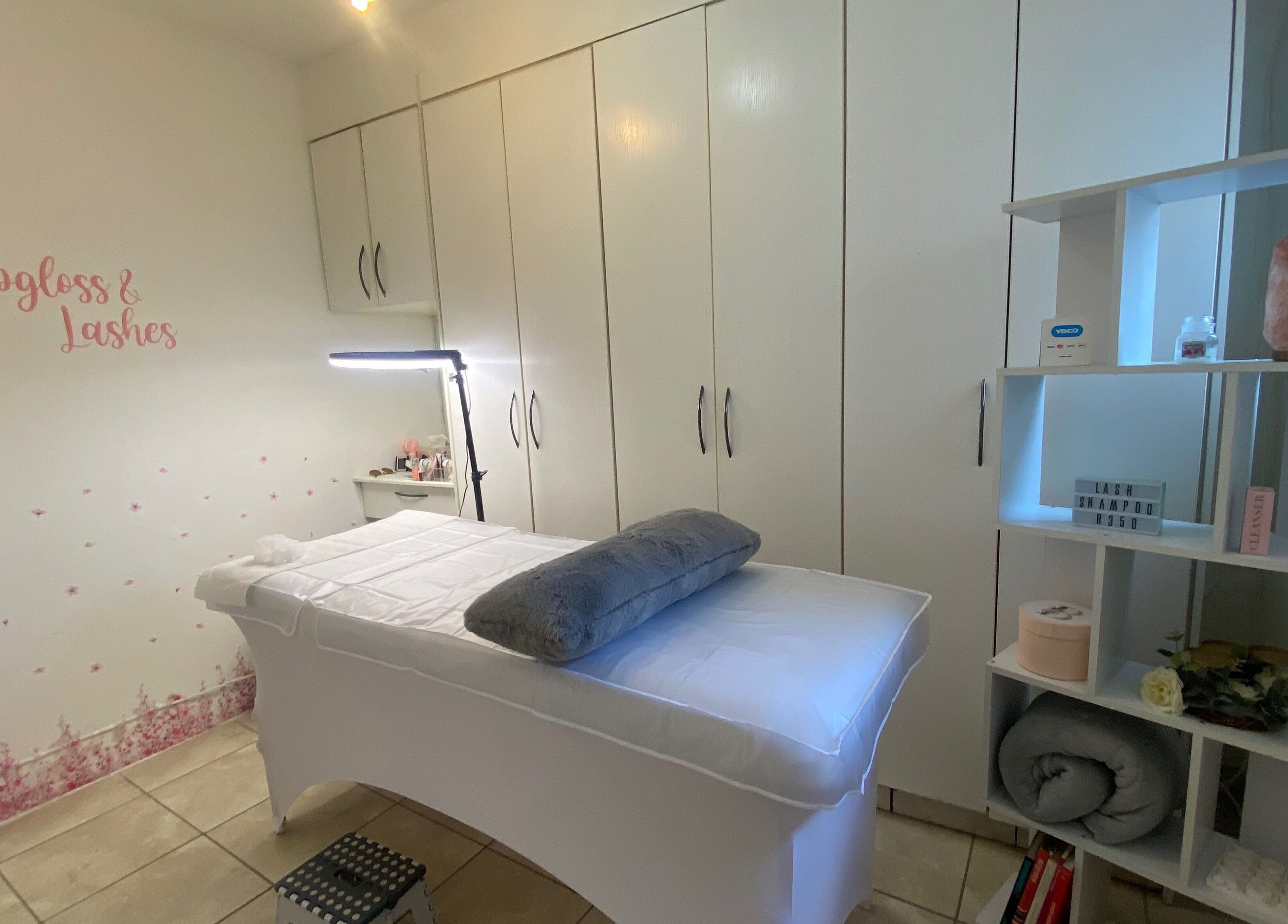 A tranquil treatment room at Lipgloss and Lashes Norwood, Johannesburg, Gauteng, ZA with a comfortable bed.