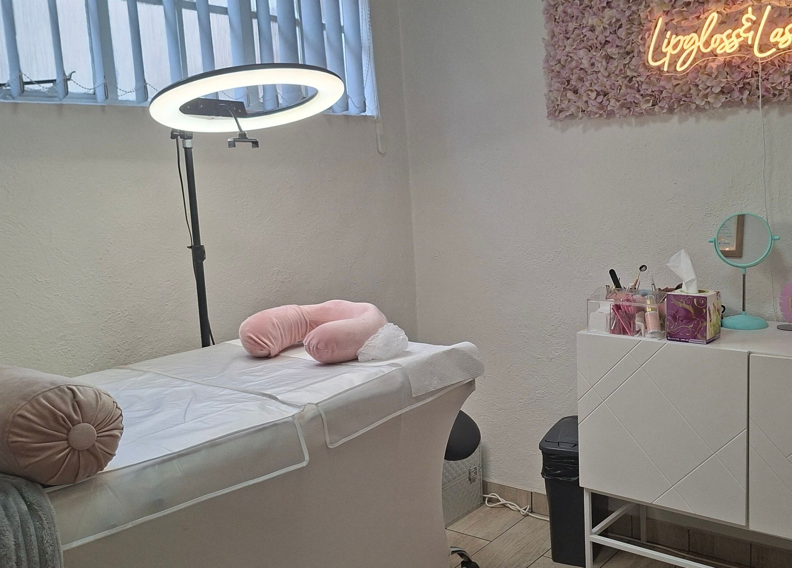 Cozy beauty treatment room at Lipgloss and Lashes Woodmead in Sandton, Gauteng, ZA with soft lighting and decor.