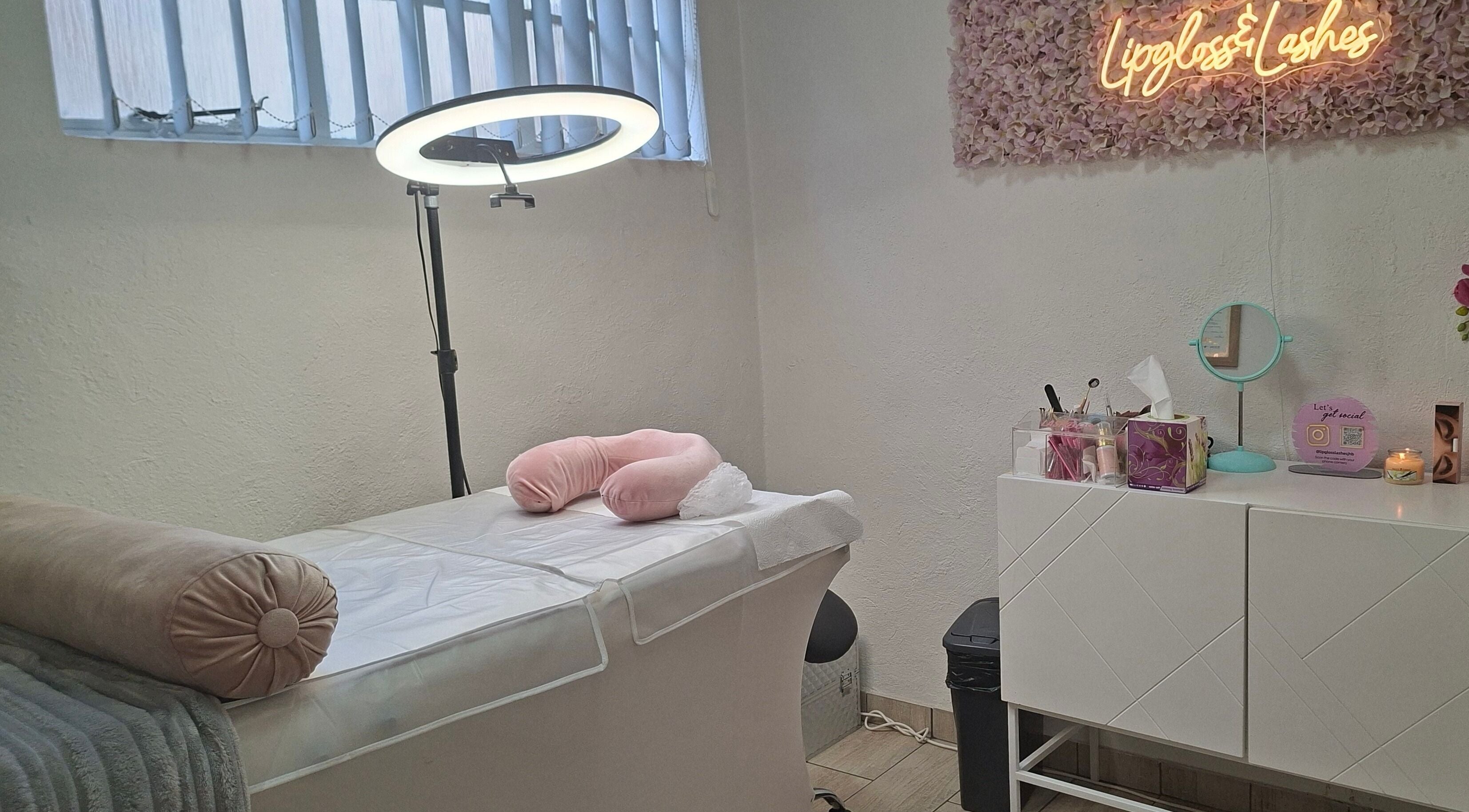 Cozy beauty treatment room at Lipgloss and Lashes Woodmead in Sandton, Gauteng, ZA with soft lighting and decor.