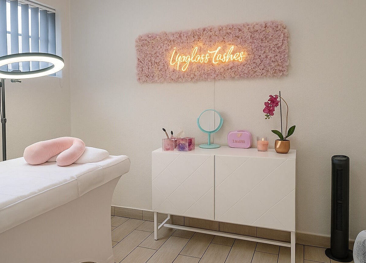 Serene spa room at Lipgloss and Lashes Woodmead, Sandton, Gauteng, ZA, featuring a massage bed and soft lighting.