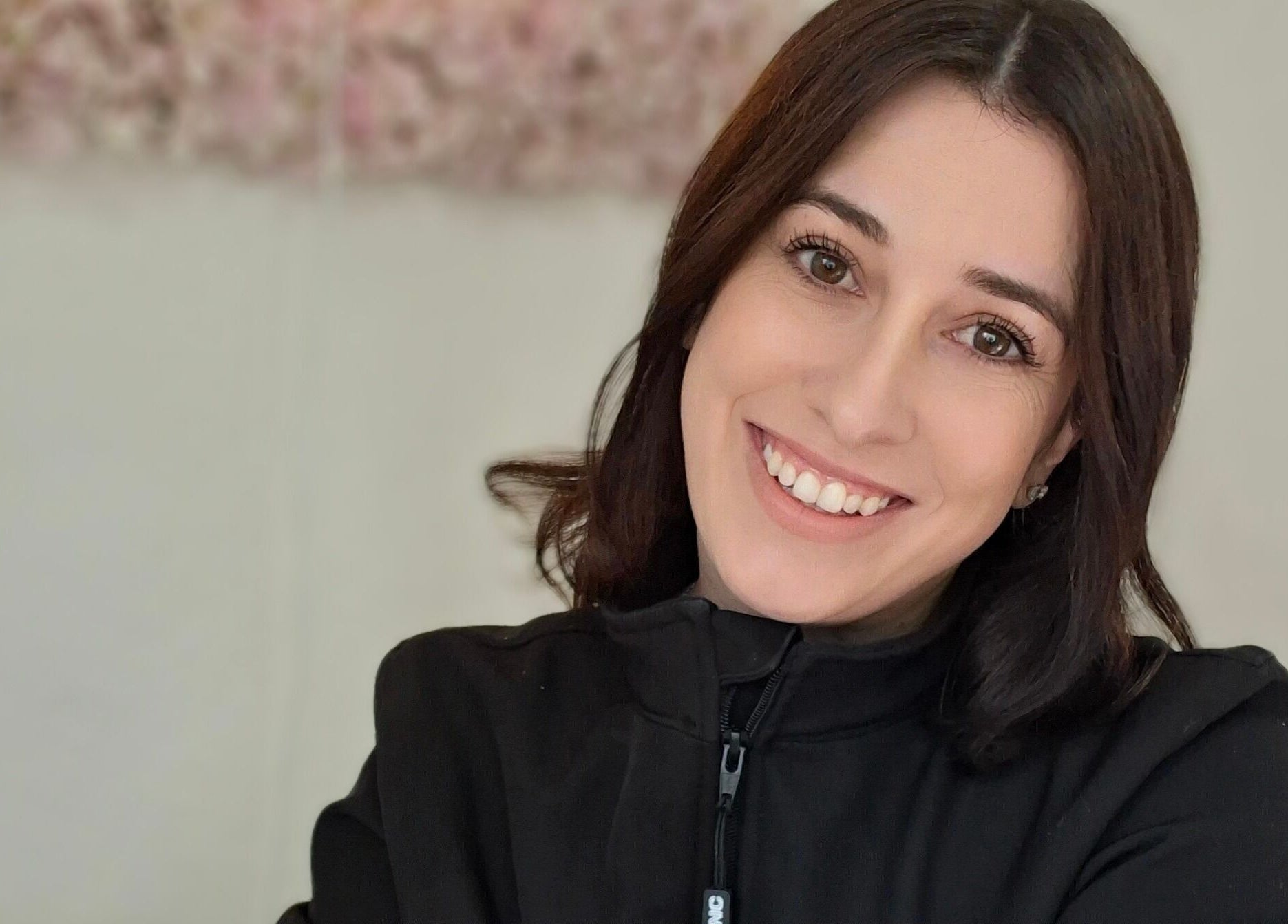 Friendly staff member at Lipgloss and Lashes Woodmead, Sandton, Gauteng, ZA, ready to assist clients.