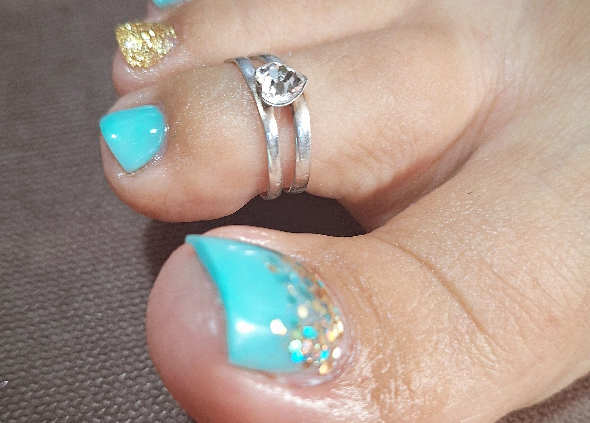 Stylish turquoise pedicure with silver toe ring at michdylan, Benoni, Gauteng, ZA.
