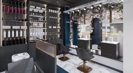Elegant interior of Kinza Makeup Salon, Ashton-under-Lyne, showcasing chic styling stations and product displays.