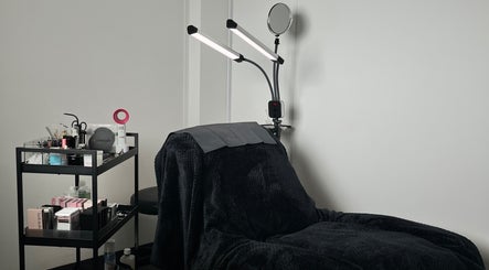 Definedbylashes in Birmingham, England, GB featuring a plush reclining beauty chair and organized beauty tools.
