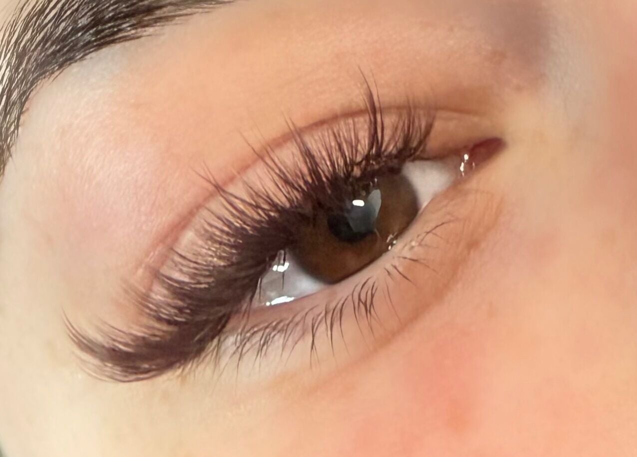 Close-up of enhanced eyelashes at Definedbylashes, Birmingham, England, GB showcasing expert lash extension.