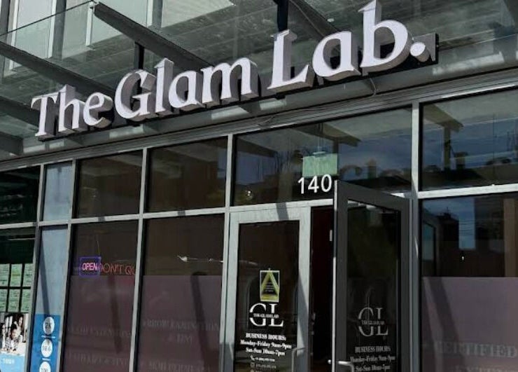 Entrance of The Glam Lab in Richmond, British Columbia, CA showcasing sleek glass facade.