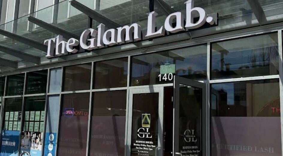 Entrance of The Glam Lab in Richmond, British Columbia, CA showcasing sleek glass facade.